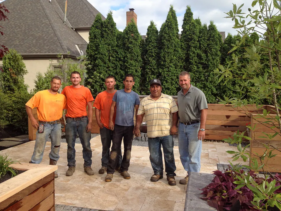 Peabody field crew standing together on a finished backyard installation